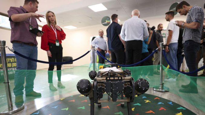 An autonomous robotic dog used in civilian and military operations, produced by the Israeli defence contractor Rafael, is presented at an exhibition at the Galilee Conference in Israel's northern city of Migdal HaEmek on September 13, 2022. Israel's aim is to become a powerhouse in the field of Artificial Intelligence, Maj. Gen. (res.) Eyal Zamir, director general of the Defense Ministry, said at the 2023 Herzliya Conference on Monday. PHOTO BY JALAA MAREY/GETTY IMAGES