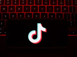 A laptop keyboard and TikTok logo displayed on a phone screen are seen in this illustration photo taken in Krakow, Poland on May 7, 2023. JAKUB PORSZYCKI/SWNS TALKER