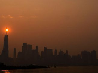 The sun rises behind the One World Trade Center, while the smoke from Canada wildfires covers the Manhattan borough as it is seen from Liberty State Park on June 8, 2023 in New Jersey. PHOTO BY EDUARDO MUNOZ ALVAREZ/GETTY IMAGES