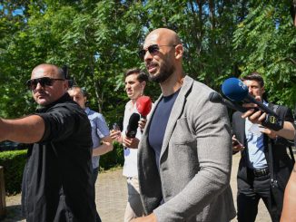 Controversial influencer Andrew Tate (C) arrives at the Municipal Court of Bucharest, Romania, on June 21, 2023. Tate had said he would train Elon Musk in a cage fight against Meta CEO Mark Zuckerberg. (Photo by Daniel MIHAILESCU / AFP) (Photo by DANIEL MIHAILESCU/AFP via Getty Images)