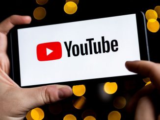 A YouTube logo seen displayed on a smartphone.YouTube has announced at VidCon, its plan to enhance the process of dubbing videos in various languages by leveraging AI technology.  MATEUSZ SLODKOWSKI/SOPA IMAGES/LIGHTROCKET VIA GETTY IMAGES.