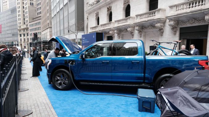 Ford Motor Co. said it is cutting prices of its F-150 Lightning pickup truck by up to $9,979 and investors reacted to the news by sending the stock lower. SPENCER PLATT/GETTY IMAGES 