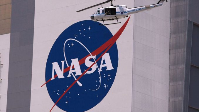 strongA helicopter provides security for the NASA astronauts as they are driven in their AstroVan to the space shuttle on May 31, 2008, in Cape Canaveral, Florida. The National Aeronautics and Space Administration's Heliophysics Science Division recently awarded NASA's Exceptional Achievement Medal to Israeli mission and instrument scientist Eliad Peretz, 40, for his contributions to several space missions. JOE RAEDLE/GETTY IMAGES/strong