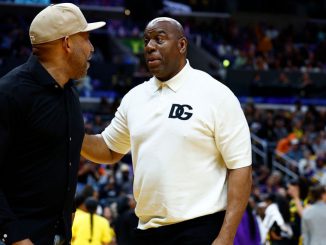 Head coach Darvin Ham of the Los Angeles Lakers and Earvin Magic Johnson attend a game between the Phoenix Mercury and the Los Angeles Sparks at Crypto.com Arena on May 19, 2023, in Los Angeles, California. SimWin Sportsstrong /strongannounced a strategic partnership with Immutable. (Ronald Martinez/Getty Images)