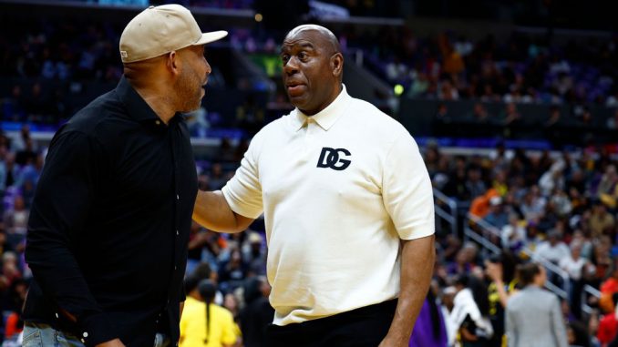 Head coach Darvin Ham of the Los Angeles Lakers and Earvin Magic Johnson attend a game between the Phoenix Mercury and the Los Angeles Sparks at Crypto.com Arena on May 19, 2023, in Los Angeles, California. SimWin Sportsstrong /strongannounced a strategic partnership with Immutable. (Ronald Martinez/Getty Images)