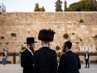 Ultra-Orthodox Jewish devotees arrive to pray at the Western Wall in the Old City of Jerusalem on June 11, 2023. According to the article, Orthodox Jews have an average of 3.3 children born per adult—more than double the 1.4, on average, for non-Orthodox Jews, per Pew.JEWEL SAMAD/AFP VIA GETTY IMAGES.