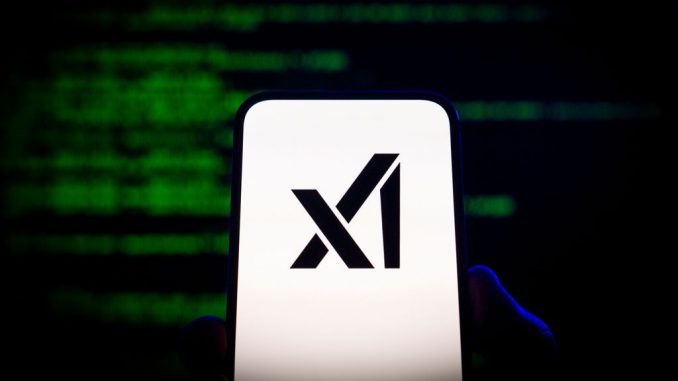 The xAI logo is seen on a mobile device in this photo illustration on July 13, 2023 in Warsaw, Poland. On Wednesday Elon Musk announced his new company xAI which he says has the goal to understand the true nature of the universe. (Jaap Arriens/NurPhoto via Getty Images)