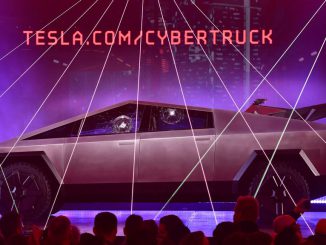 People take pictures of the newly unveiled all-electric battery-powered Tesla's Cybertruck with shattered windows after a failed resistance test, at Tesla Design Center in Hawthorne, California on November 21, 2019. While the Cybertruck has been seen multiple times a href=https://www.Zenger News.com/news/23/07/33192701/elon-musk-says-cybetrucks-camo-wrap-makes-it-practically-invisible-take-a-lookin a camouflage wrap/a, now the electric pickup truck was, recently, seen sporting a darker camo wrap, barely veiling its design details and adding an air of mystery. PHOTO BY FREDERIC J. BROWN/GETTY IMAGES