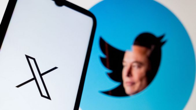 In this photo Illustration a X logo is seen on a smartphone screen and an effigy of Elon Musk with the Twitter logo as background in Athens, Greece on July 25, 2023. PHOTO BY NIKOLAS KOKOVLIS/GETTY IMAGES