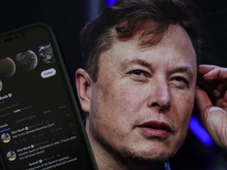 Elon Musk's twitter profile is displayed on a mobile phone and the image of him is seen on a computer screen on back of it in Ankara, Turkiye on October 06, 2022. Dittmann, Musk's vocal doppelganger on X, clarified that no AI tool was used during their conversation and that his voice was natural. MUHAMMED SELIM KORKUTATA/ANADOLU AGENCY.