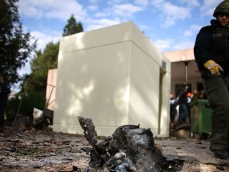  An Israeli looks at a piece of metal with shrapnel holes in it at the scene of a Palestinian rocket hit next to the dining room in 2009, in Kibbutz Karmia, Israel. Ortech Defense Solutions, inspired by the need to defend the community from terrorism was founded in 2006 by Naor who lived in Kibbutz Karmia most of his life, just as the suicide bombing wave was subsiding.URIEL SINAI/GETTY IMAGES. 