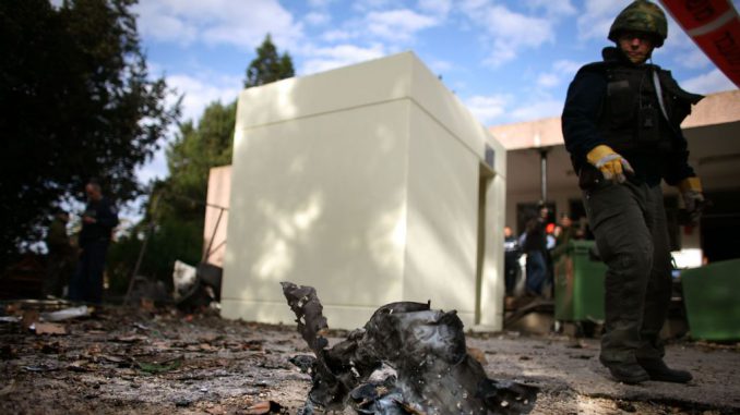  An Israeli looks at a piece of metal with shrapnel holes in it at the scene of a Palestinian rocket hit next to the dining room in 2009, in Kibbutz Karmia, Israel. Ortech Defense Solutions, inspired by the need to defend the community from terrorism was founded in 2006 by Naor who lived in Kibbutz Karmia most of his life, just as the suicide bombing wave was subsiding.URIEL SINAI/GETTY IMAGES. 