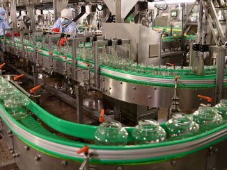 SHIJIAZHUANG, CHINA - AUGUST 02: Employees work on the production line of bottled fruit at Hebei Huaquan Foodstuffs Co., Ltd. on August 2, 2023 in Shijazhuang, Hebei Province of China. (Photo by Li Mingfa/VCG via Getty Images)