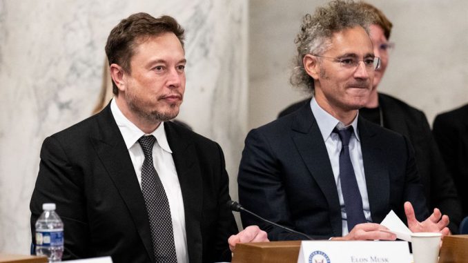 Elon Musk, CEO of Tesla and owner of X, left, and Palantir CEO Alex Karp arrives participate in the AI Insight Forum in the Russell Senate Office Building in September 2023. BILL CLARK/CQ-ROLL CALL, INC VIA GETTY IMAGES.