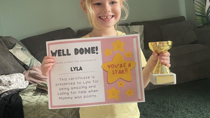 Lyla Leathem with a trophy and certificate for helping her mother. LEAH BIGGS VIA SWNS.